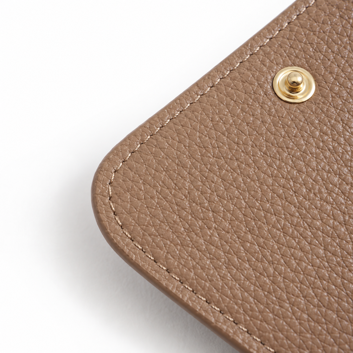 Close-up of pebbled leather grain and stitching