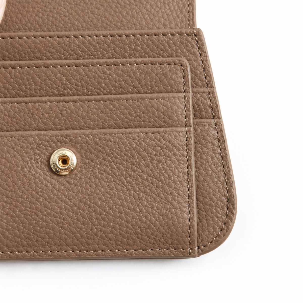 Close-up of card slots and gold snap button